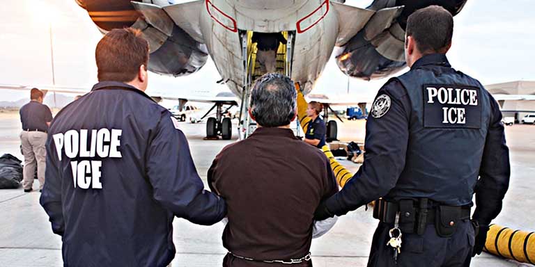 Federal immigration agents board Hispanic man onto a plane