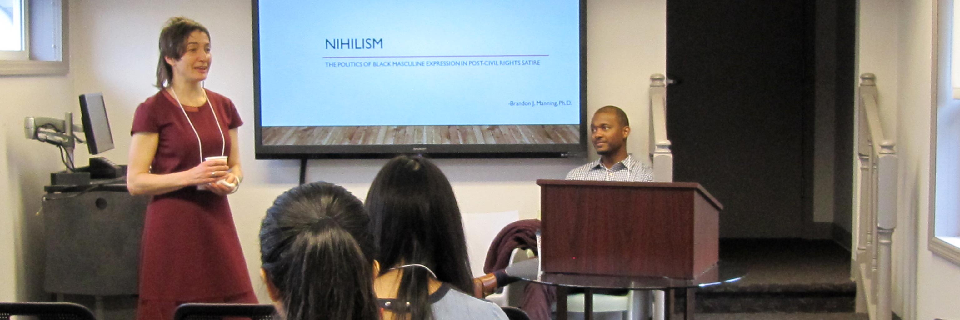 Student presents a PowerPoint slide defining "nihilism" to her class